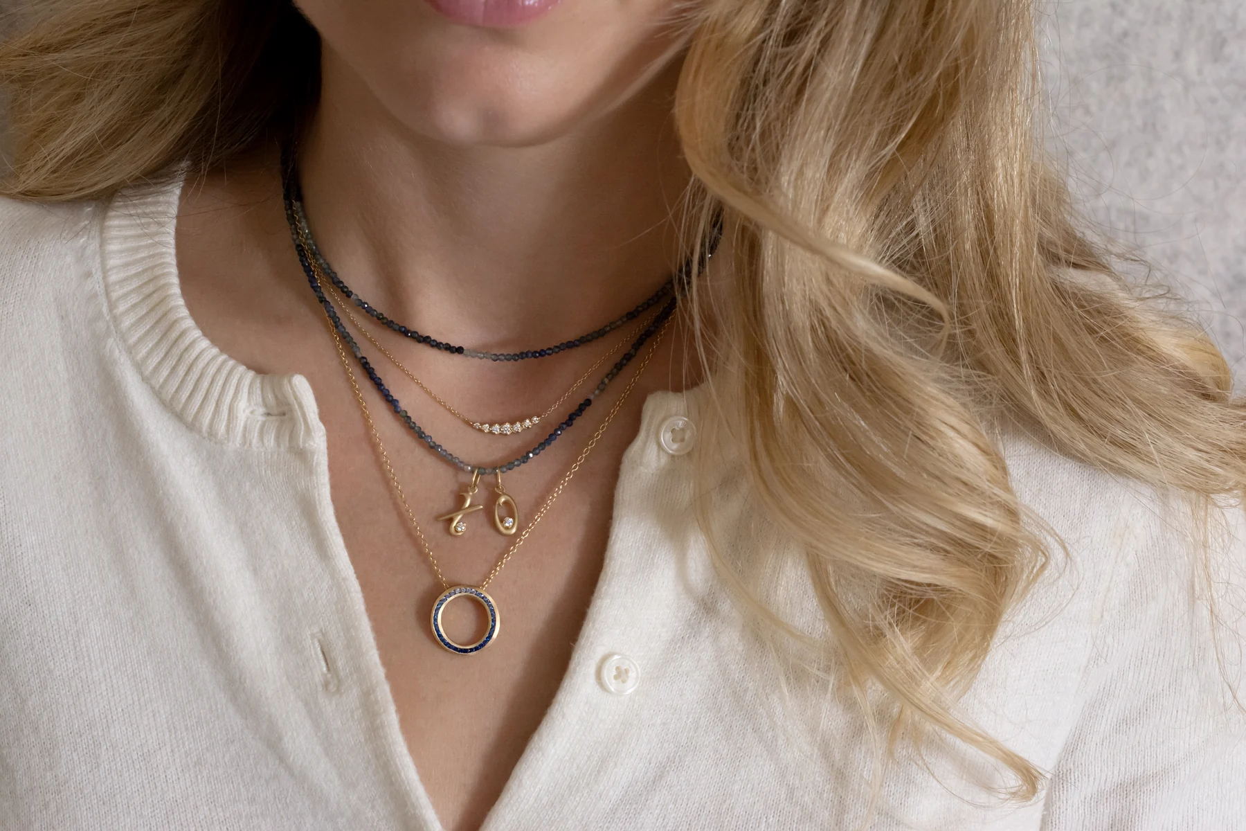 Gold charms and gradient sapphire wrap bracelet