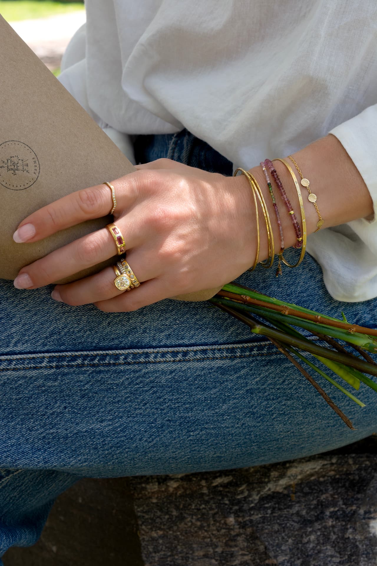 Gold bangles and gemstone wrap bracelets styled together