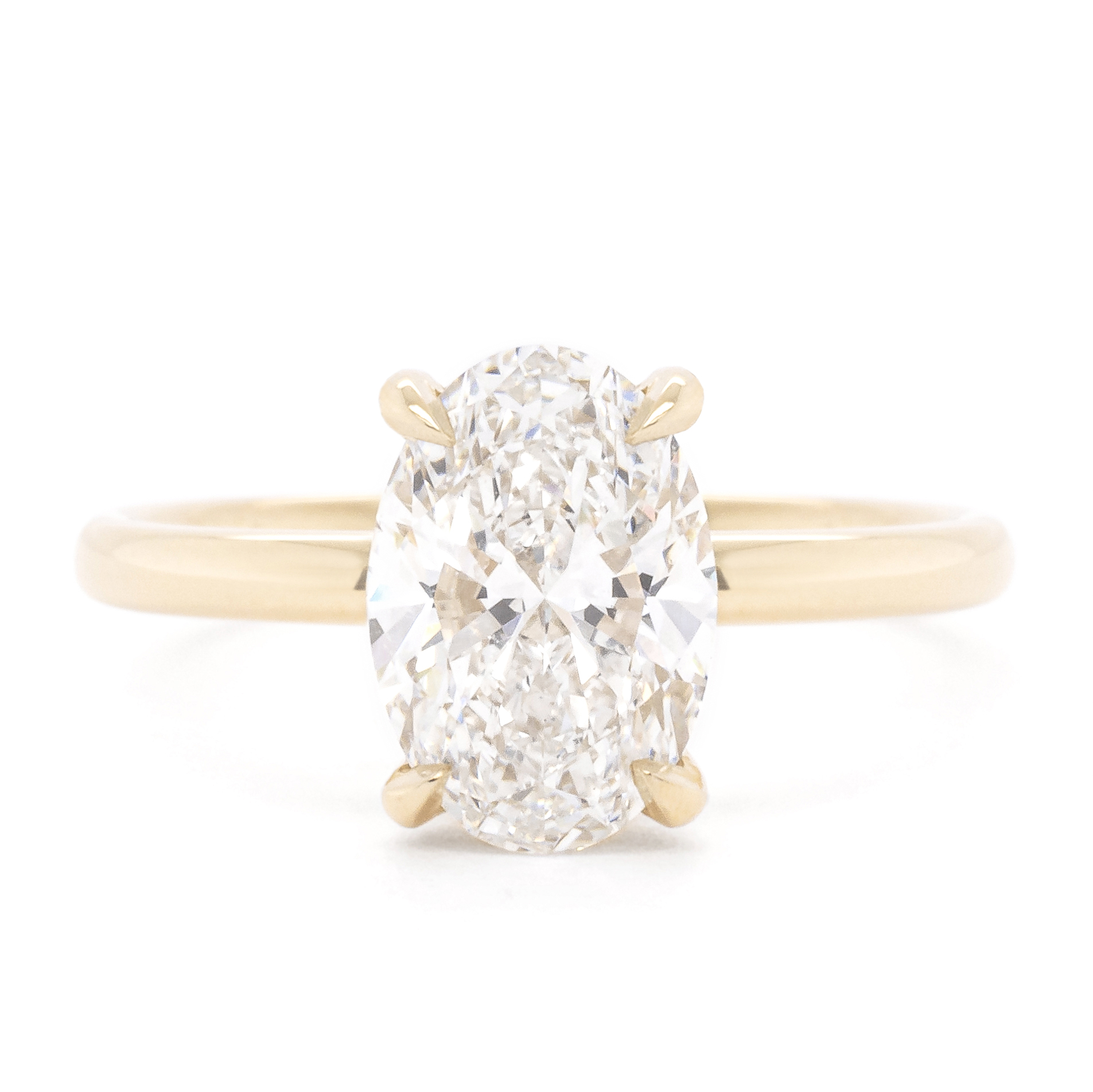 Engagement rings showing oval, round, cushion and pear centre stone shapes