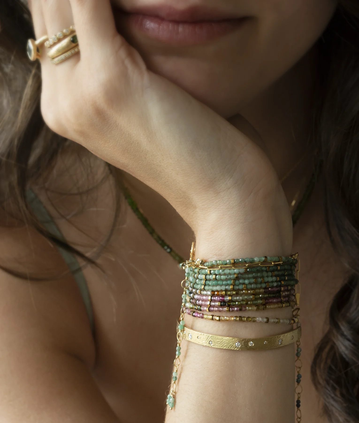 Emerald jewellery styled with a gemstone wrap bracelet