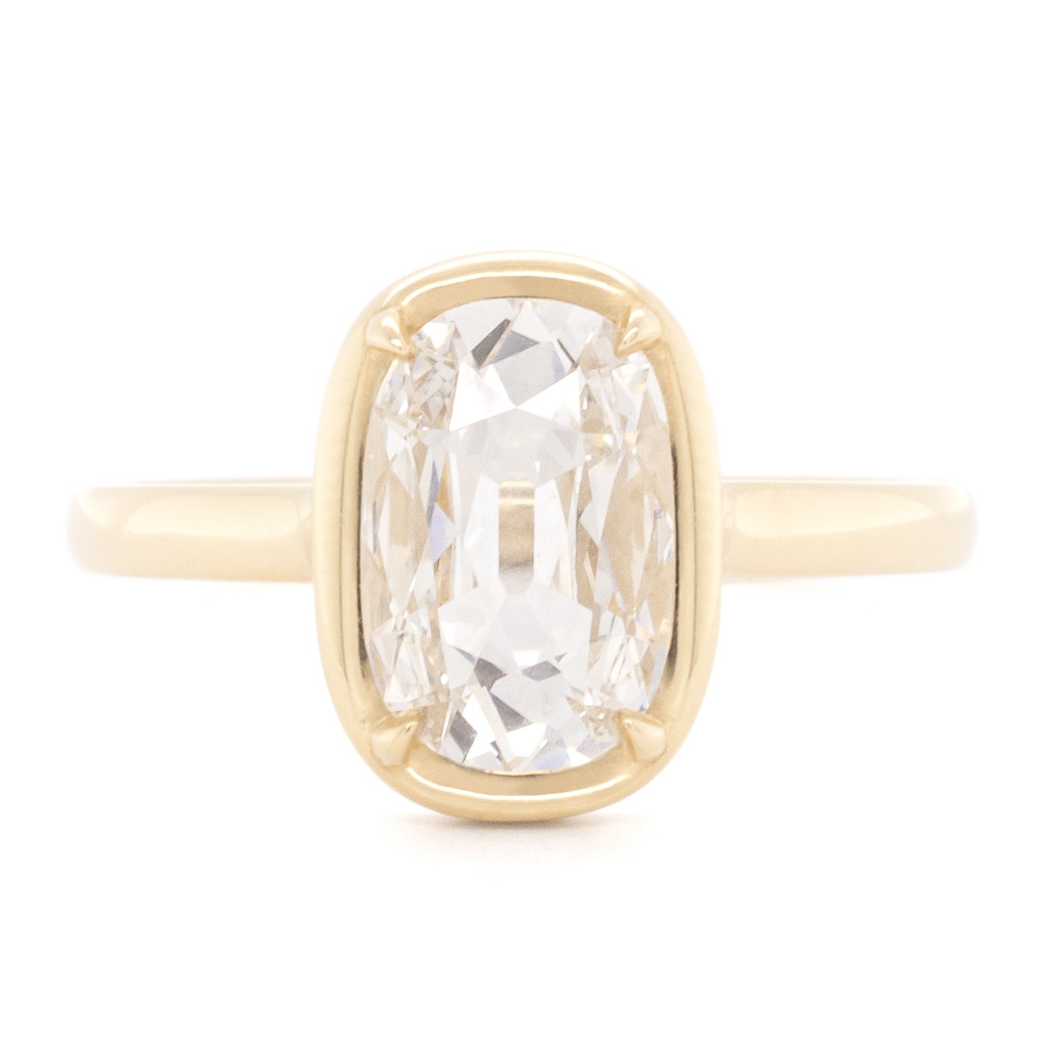 Hand-made gold band and prong detail on an Anne Sportun setting