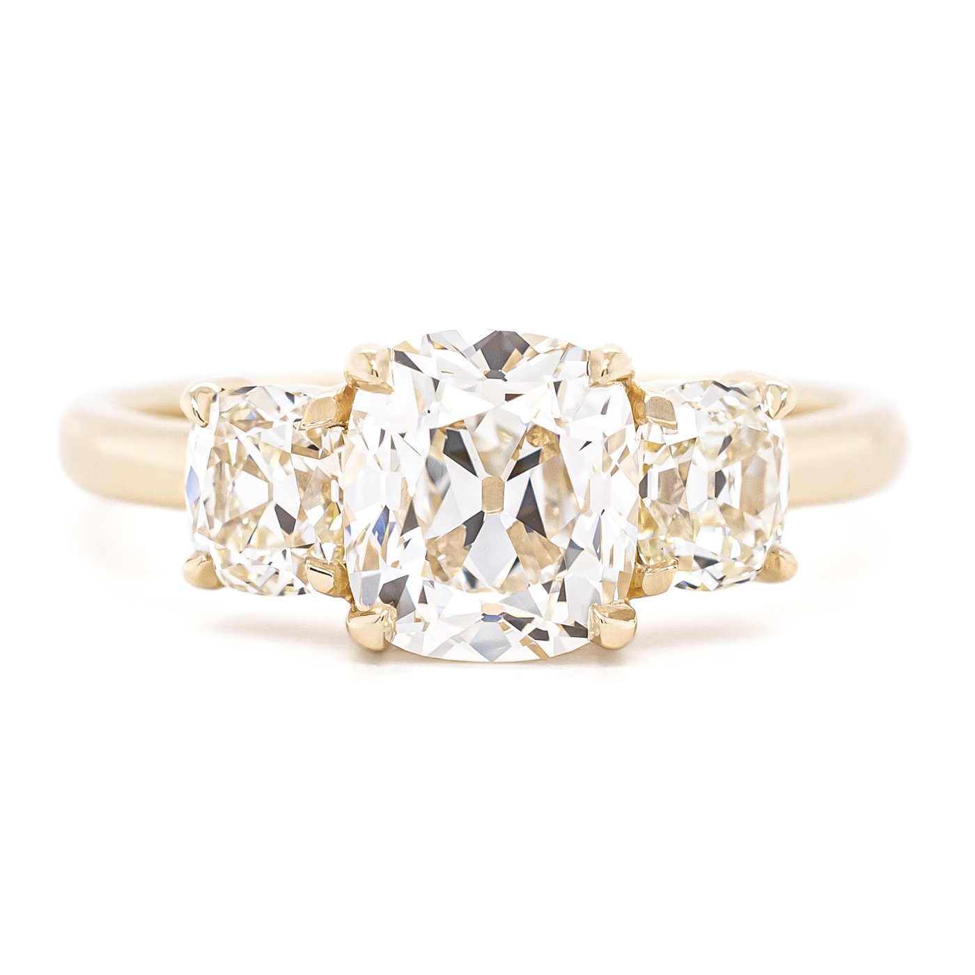 Cushion cut centre stone with old mine cut diamond side stones