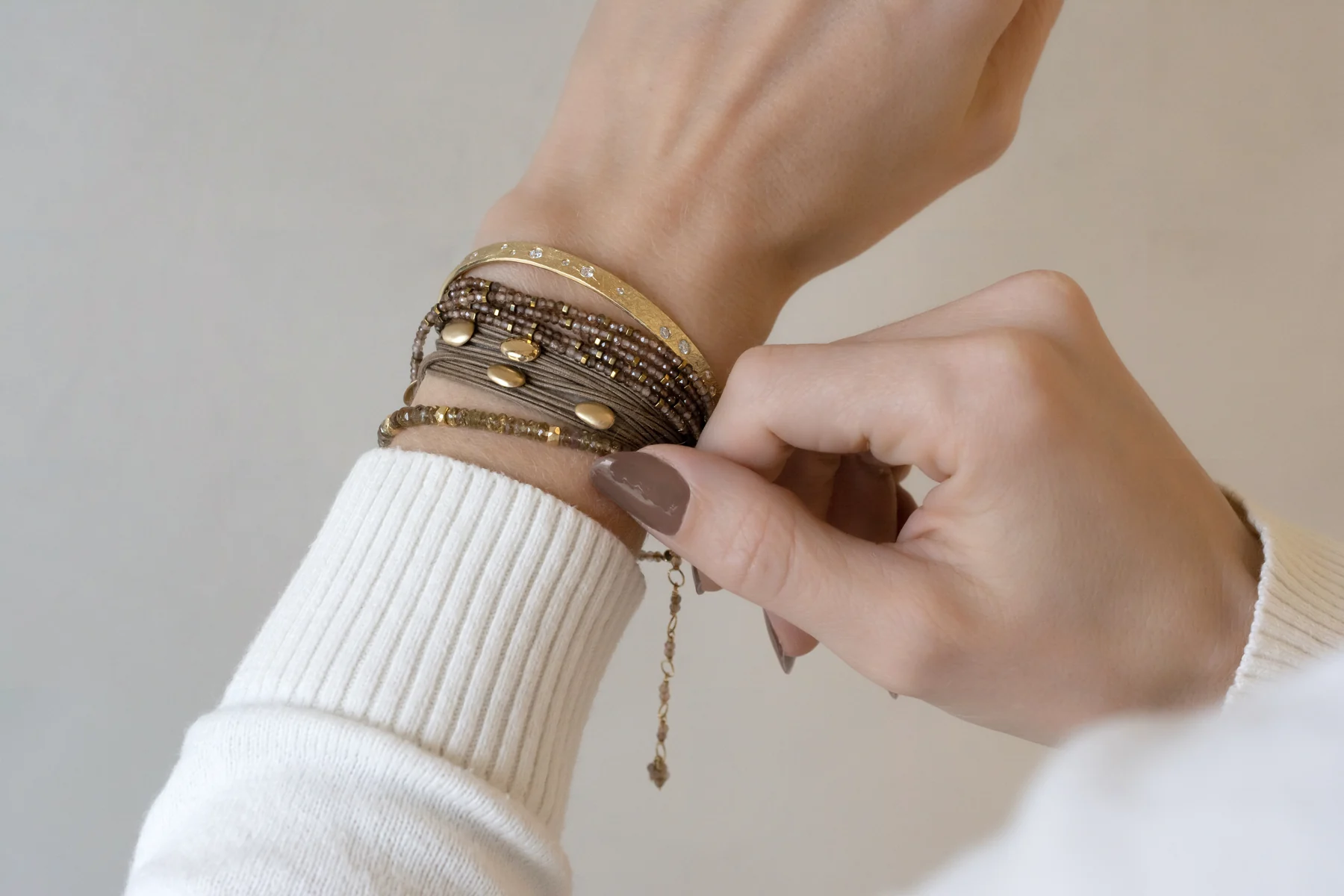 Taupe and garnet gemstone wrap bracelets with gold accents
